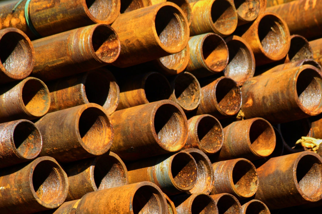 Multiple rusty metal pipes